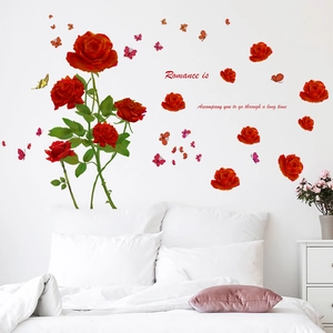 Romantic red rose wall decals with butterflies and quote over a white bedroom headboard