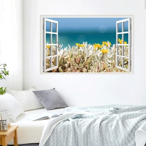 Detail of creative window-view wall sticker showing yellow wildflowers and blue sea view