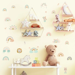 Detail of Morandi-colored animal wall stickers featuring a lion, giraffe, and rainbow