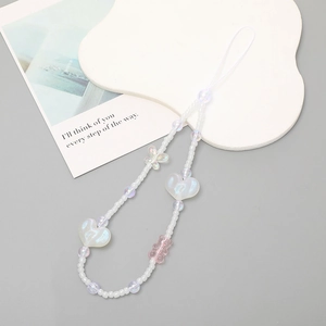 Beaded phone strap with pink bear and iridescent heart charms on a white cord