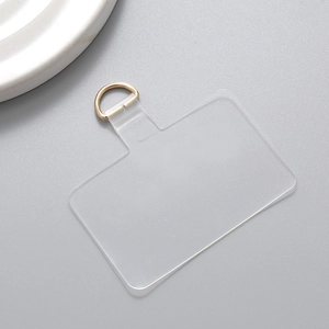 Close-up of clear TPU phone lanyard patch with durable gold metal D-ring attachment