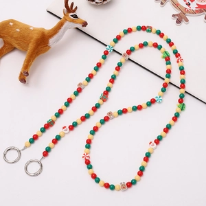 Dragonne de téléphone perlée de Noël avec breloques Père Noël et renne en rouge et vert