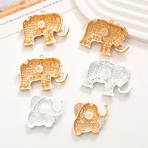 DIY rhinestone elephant alloy charms in gold and silver finish on minimalist background