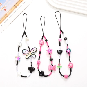 Y2K style beaded phone charm straps with black and white butterfly and heart pendants