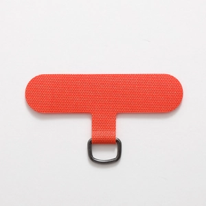 Macro detail of high-density orange polyester phone lanyard patch with metal D-ring buckle