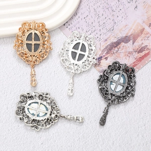 Vintage metal pendant set in gold and silver with cameo style relief decoration