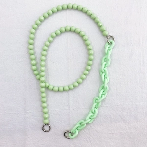 Detail view of light green acrylic phone lanyard with faceted beads and chunky chain links