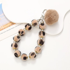 Leopard print plush ball phone charm and keychain with stylish brown pompom and silver clip