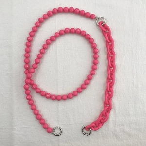 Close-up of pink acrylic beaded crossbody phone chain with silver metal ring clasp