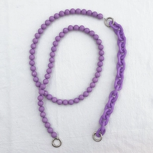 Detail of purple acrylic beaded chain with silver metal rings for DIY phone case or handbag