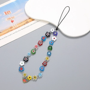 Bijou de téléphone fait main perles fleurs en verre coloré et pendentif papillon