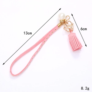 Porte-clés en daim rose avec pompon à rivets, cage en cristal doré et perle d'imitation