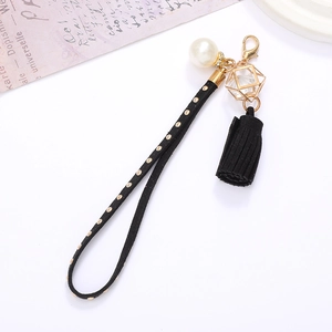 Dragonne de téléphone en velours avec rivets, perle, pendentif doré et gland noir