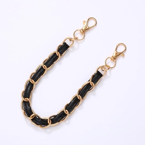 Classic gold metal chain intertwined with black leather and dual rotating lobster clasps