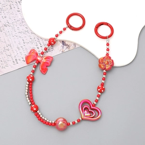 Creative Chinese style red beaded phone chain with lucky charms and heart bow accents