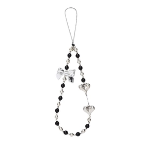 Y2K style beaded phone chain with silver bow and heart charms on white background