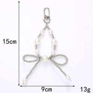 Porte-clés avec perles et nœud argenté, fermoir mousqueton, hauteur 15cm, poids 13g