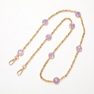 Golden crossbody chain strap with purple smiley face charms and lobster clasps