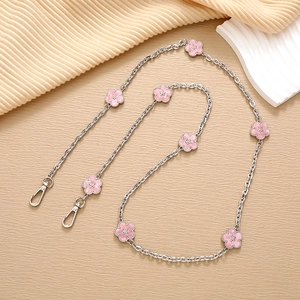 Crossbody metal phone chain with pink cherry blossom charms and lobster clasps