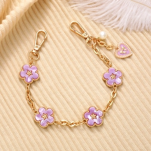 Golden chain accessory with purple enamel flowers, pearl and heart charm for phone or bags