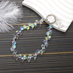 Iridescent crystal teardrop beaded charm with silver lobster clasp and metal coin tag