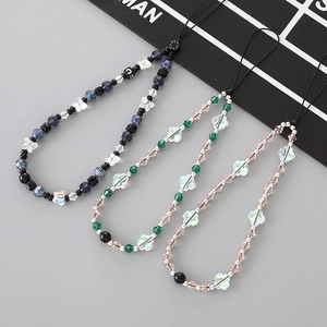Handmade crystal butterfly beaded phone charms in pink, purple, and green colors