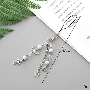 Detail of silver beaded phone charm with star and wing pendants showing 16cm length size