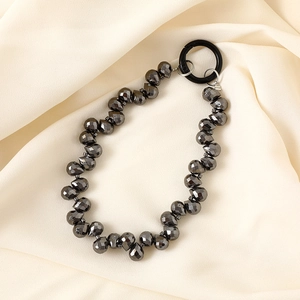 Close-up of gunmetal faceted crystal beaded chain with black spring ring buckle