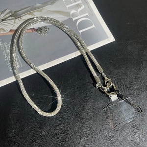 Close-up of sparkling rhinestone phone strap with silver lobster claw and clear insert