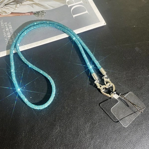 Detail of luxury lake blue rhinestone crossbody phone chain with silver heart clasp