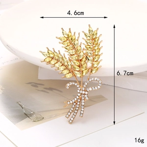 Golden wheat ear brooch with yellow crystals and bow detail, size 4.6cm x 6.7cm