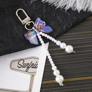 Pendentif papillon iridescent avec glands en perles blanches et fermoir en métal argenté