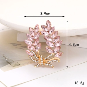 Golden wheat ear brooch with pink marquise crystals and diamond bow accessory