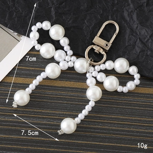 Fashionable white pearl bow pendant charm with golden lobster clasp for bags and keys