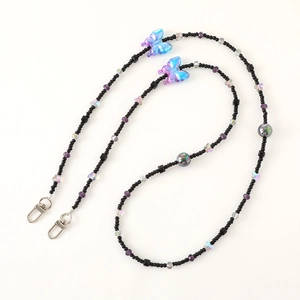 Detail of beaded strap with purple gradient butterflies and silver lobster clasps