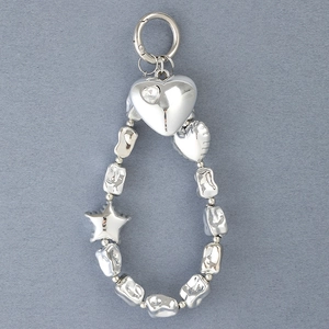 Silver beaded keychain with heart and star charms on textured dark gray background