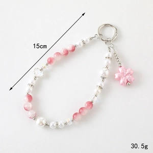 Bijou de sac en perles roses avec cœur et fleur 15cm de long et 30,5g de poids