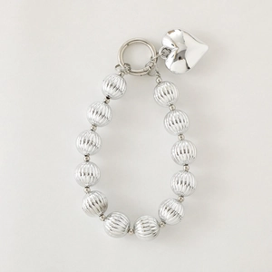 Silver beaded floral phone charm with heart pendant and metallic striped beads accessory
