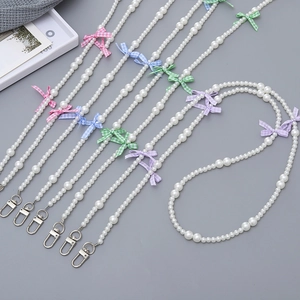 Elegant pearl phone lanyard with colorful fabric bows and silver metal lobster clasps