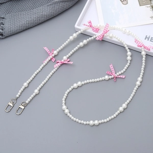 Chic pearl phone strap with pink bow accent and silver metal clasp for women