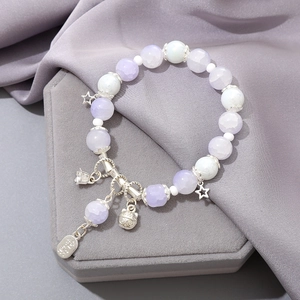 Elegant beaded crystal bracelet with silver cat charms and star pendants on silk