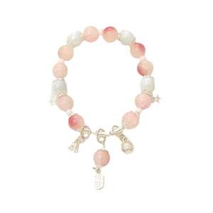 Elegant beaded bracelet with pink crystals, moonstones, star charm and bell pendants