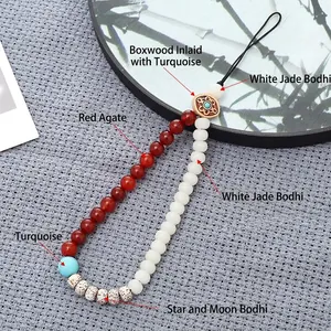 Chinese style phone charm with Bodhi beads, Red Agate, and Turquoise on a fan background