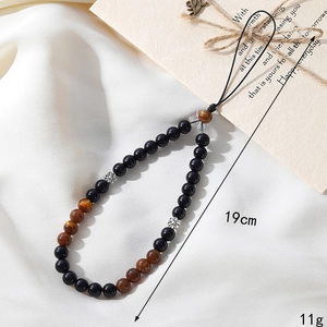 Detailed macro view showing the 19cm length and 11g weight of the beaded phone strap