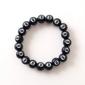 Handmade elastic acrylic bracelet featuring black billiard 8 ball beads for sports fans