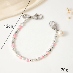 Dragonne élégante 12cm en perles avec billes roses et fermoir coeur en argent