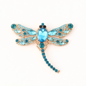 Elegant gold-tone dragonfly brooch with sparkling blue gradient crystals and rhinestones