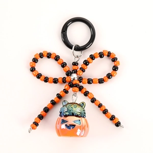 Porte-clés Halloween perles orange et noir avec pendentif citrouille et chat