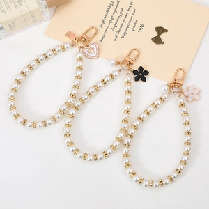 Elegant pearl keychain set with crystal rings and enamel heart flower charms for phone