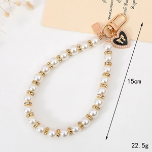 Fashion pearl beaded keychain with heart bow pendant and gold accents, length 15cm